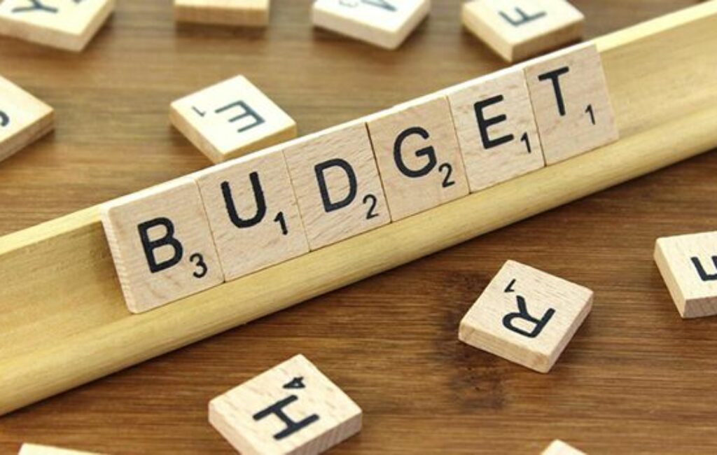 Illustration of budget-friendly strategies for enhancing website features and quality for trade shows, including sponsorship and promotion packages