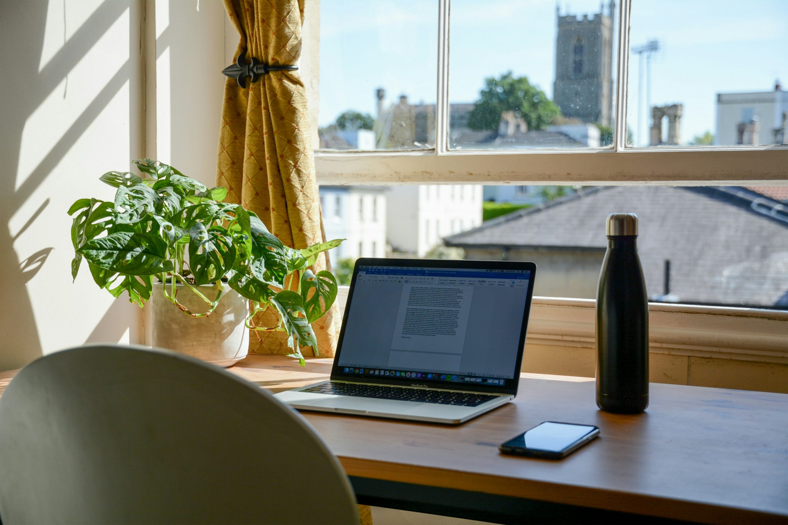 Team collaborating in a hybrid workspace, representing a flexible work model that balances remote and in-office productivity.